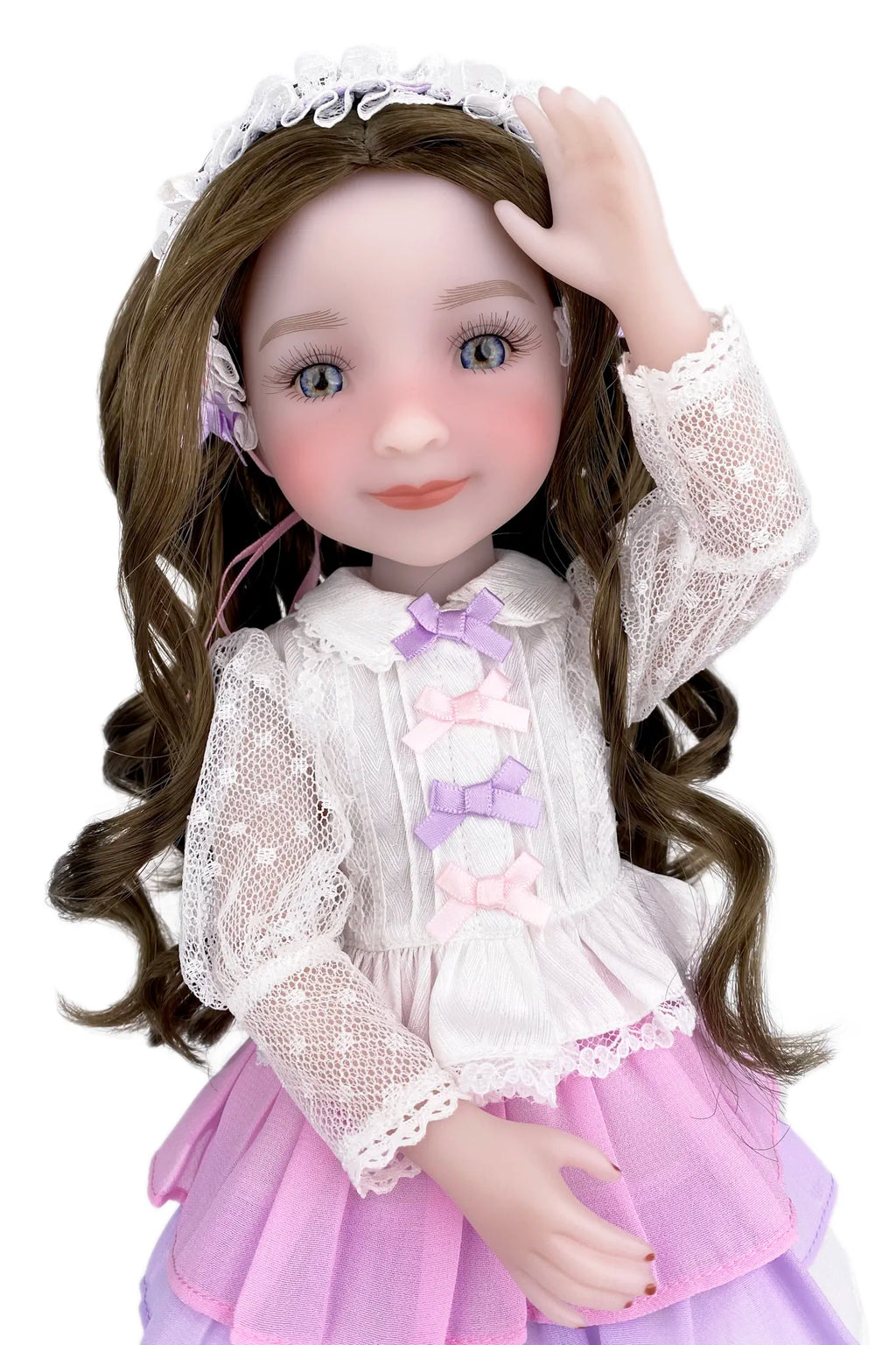 Detailed doll with brown hair, white lace outfit, and pink skirt on a white background