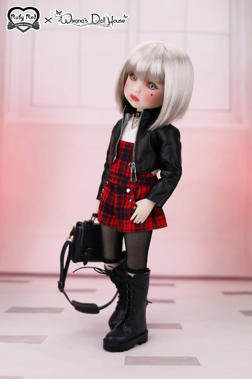 Doll wearing a black jacket, red plaid skirt, and black boots with a handbag on a white background.