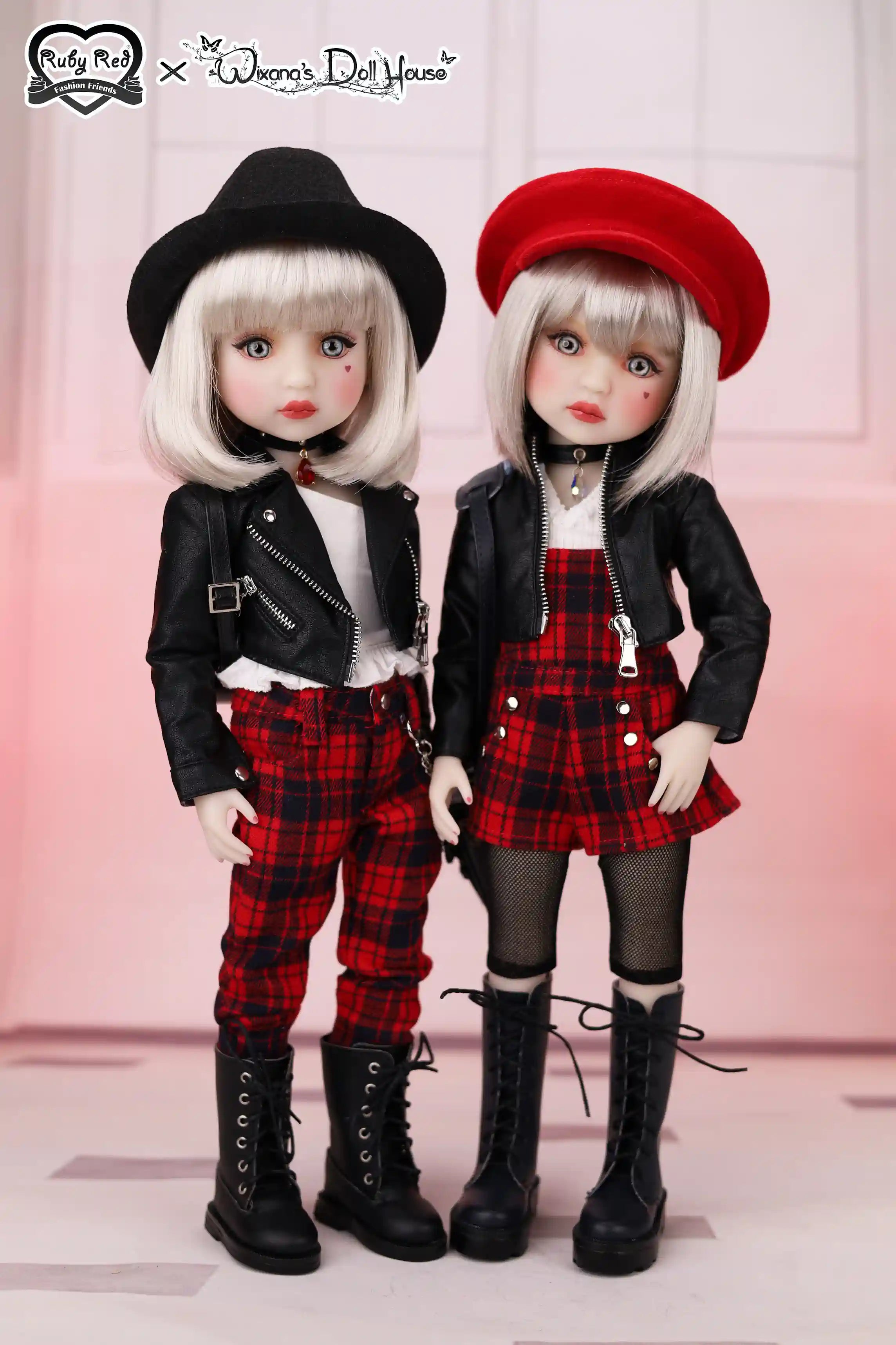 Two dolls in stylish outfits with plaid pants and black jackets, wearing hats and boots.