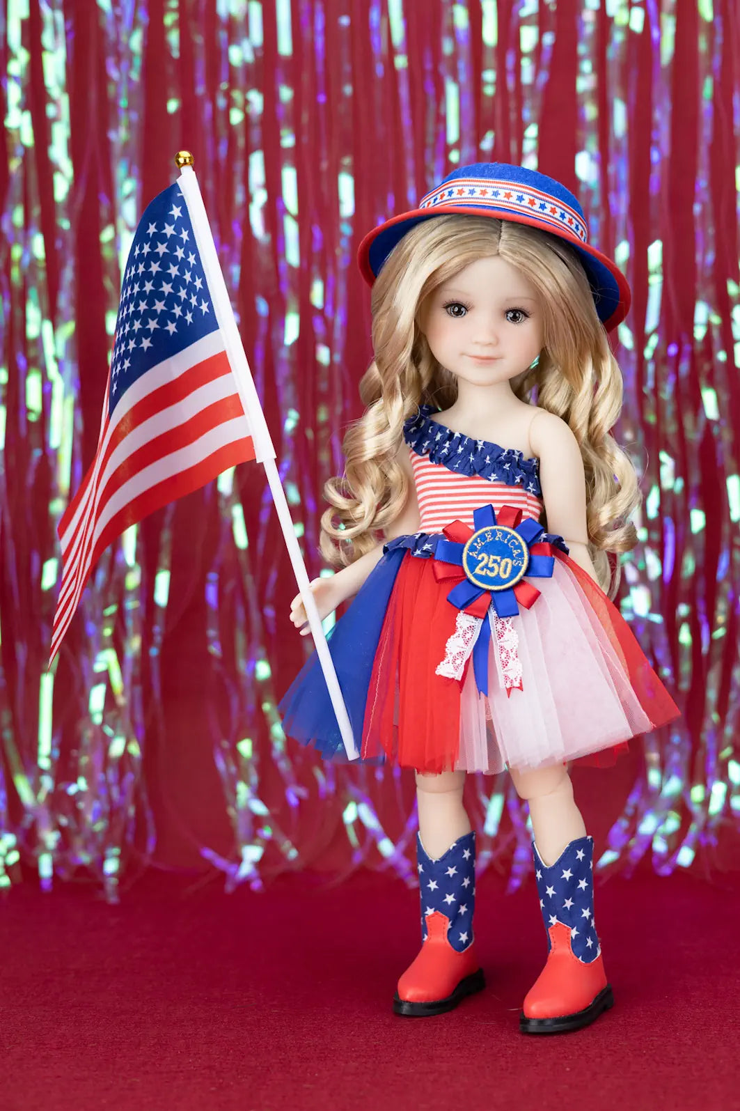 Doll in patriotic outfit with American flag and red, white, and blue accessories against a festive background.