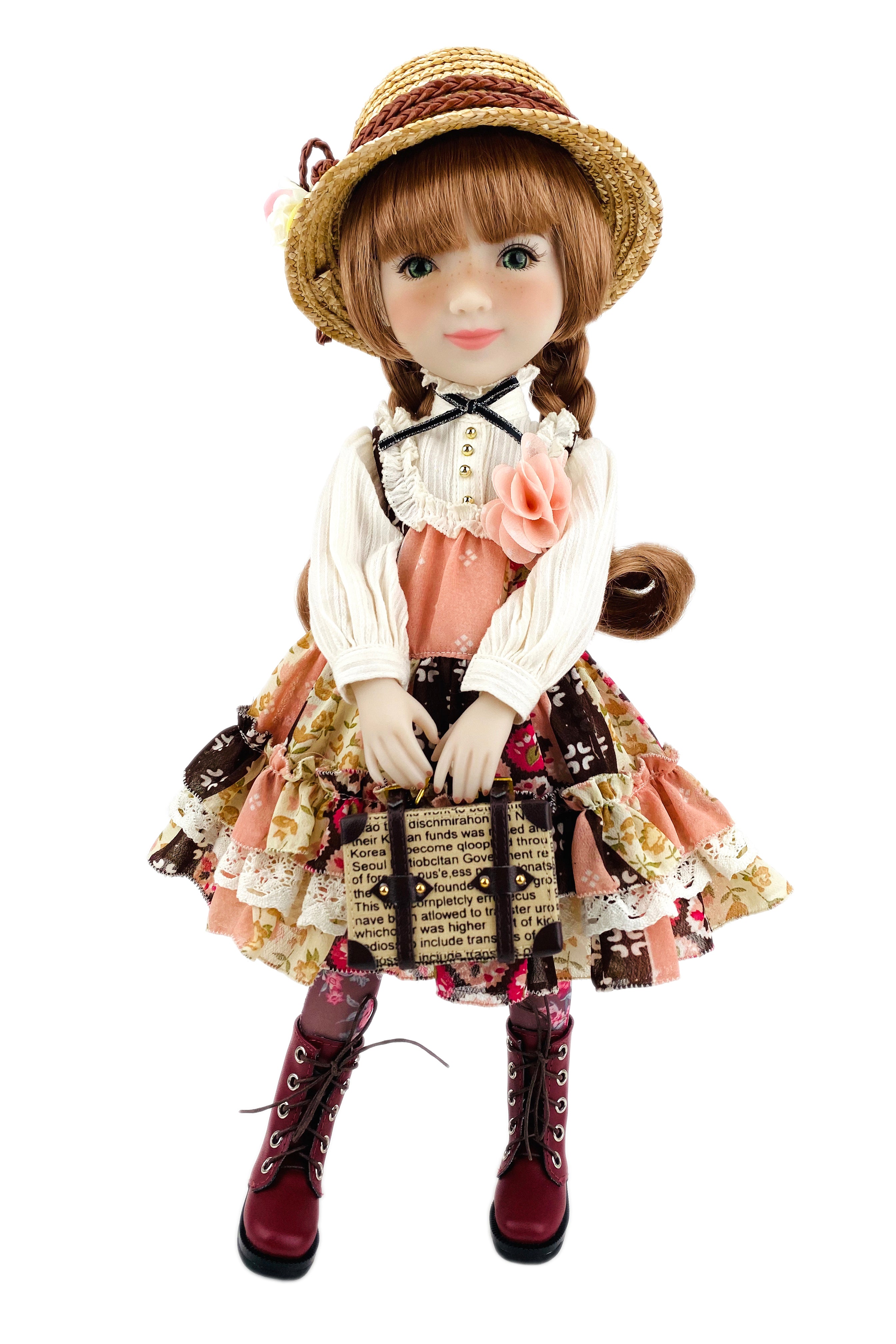 Vintage-style doll with a hat, dress, and boots on a white background