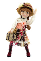 Doll in a vintage outfit with a hat and floral dress on a white background