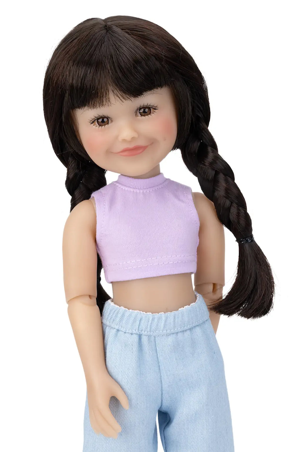 Doll with braided hair wearing a purple top and light blue pants on a white background