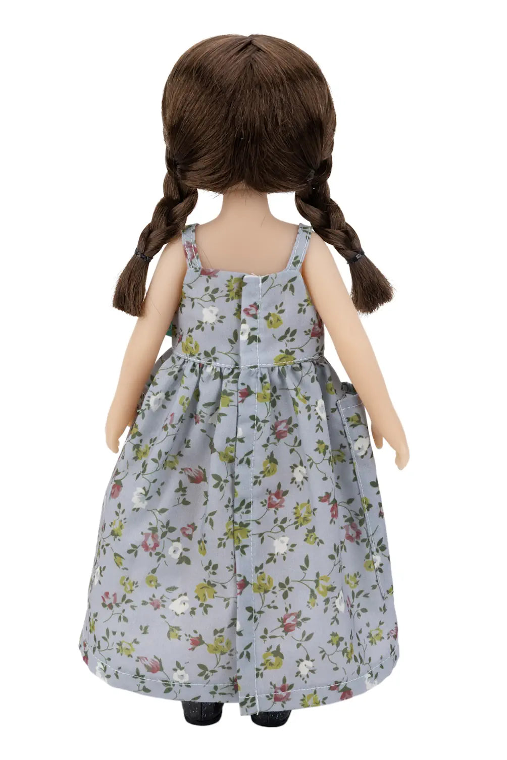 Doll wearing a floral dress on a white background