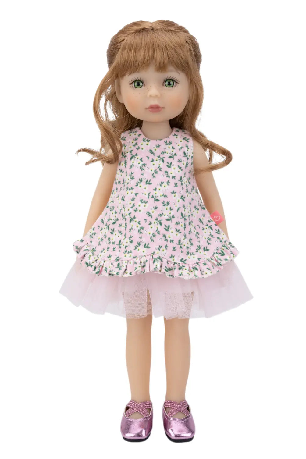 Doll wearing a floral dress on a white background