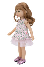 Doll wearing a floral dress with a white background