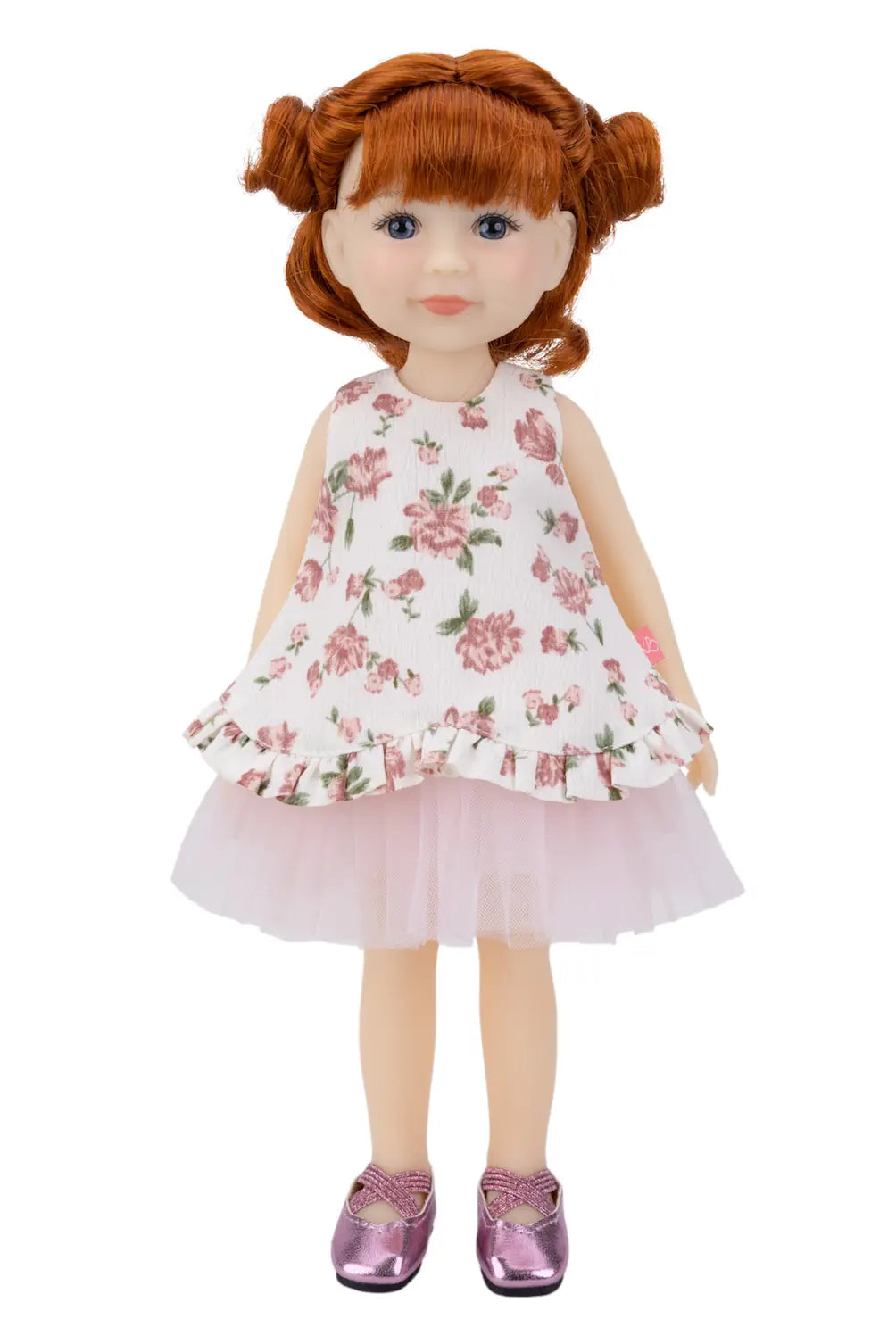 Doll with red hair wearing a floral dress on a white background