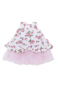 Floral dress with pink ruffled skirt on a white background