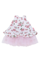 Floral dress with pink ruffled skirt on a white background