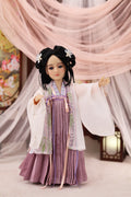 Traditional doll in a flowing dress with a soft, blurred background