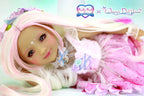 Doll with pink hair and fairy outfit