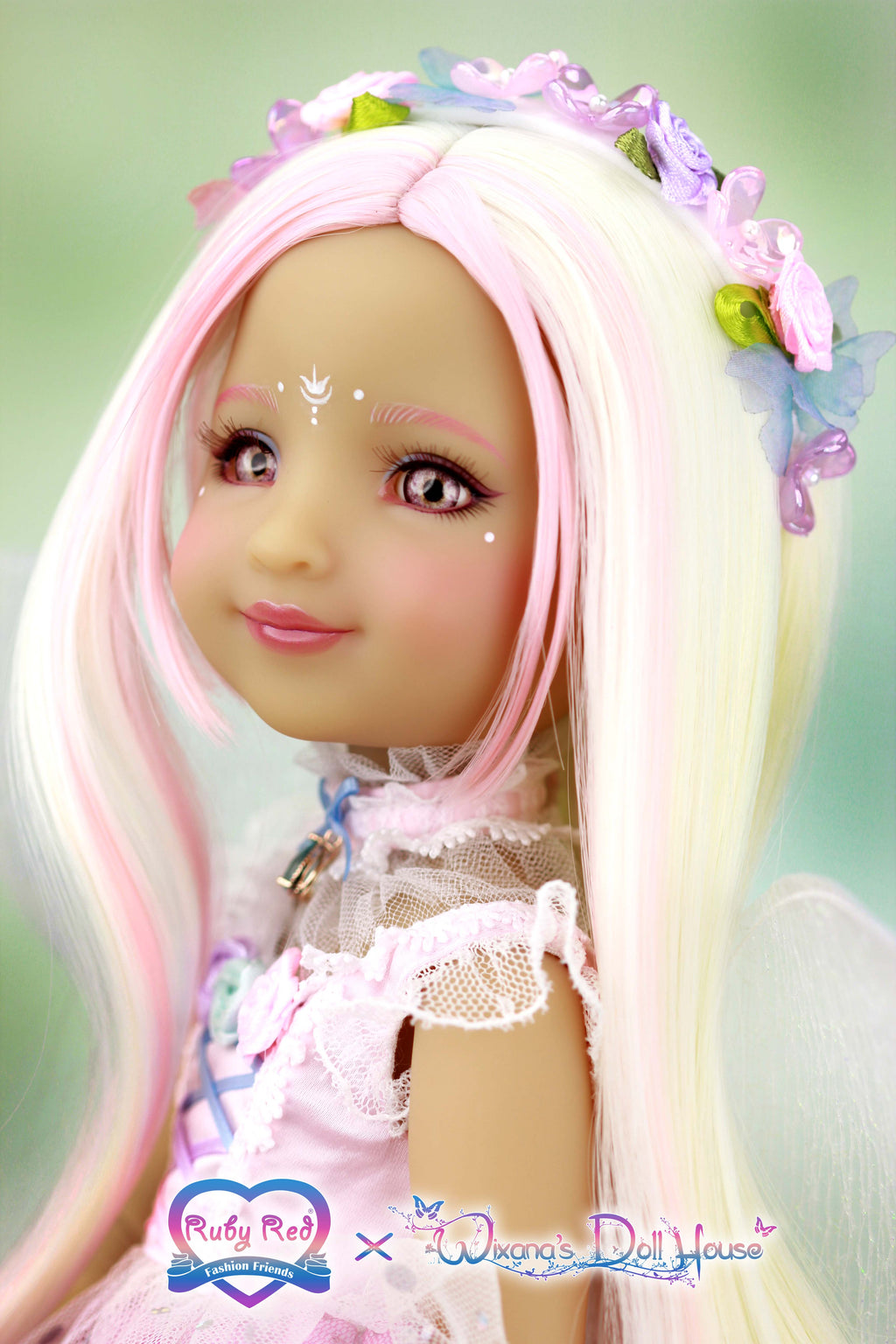 Doll with long blonde hair and pink accessories against a light green background