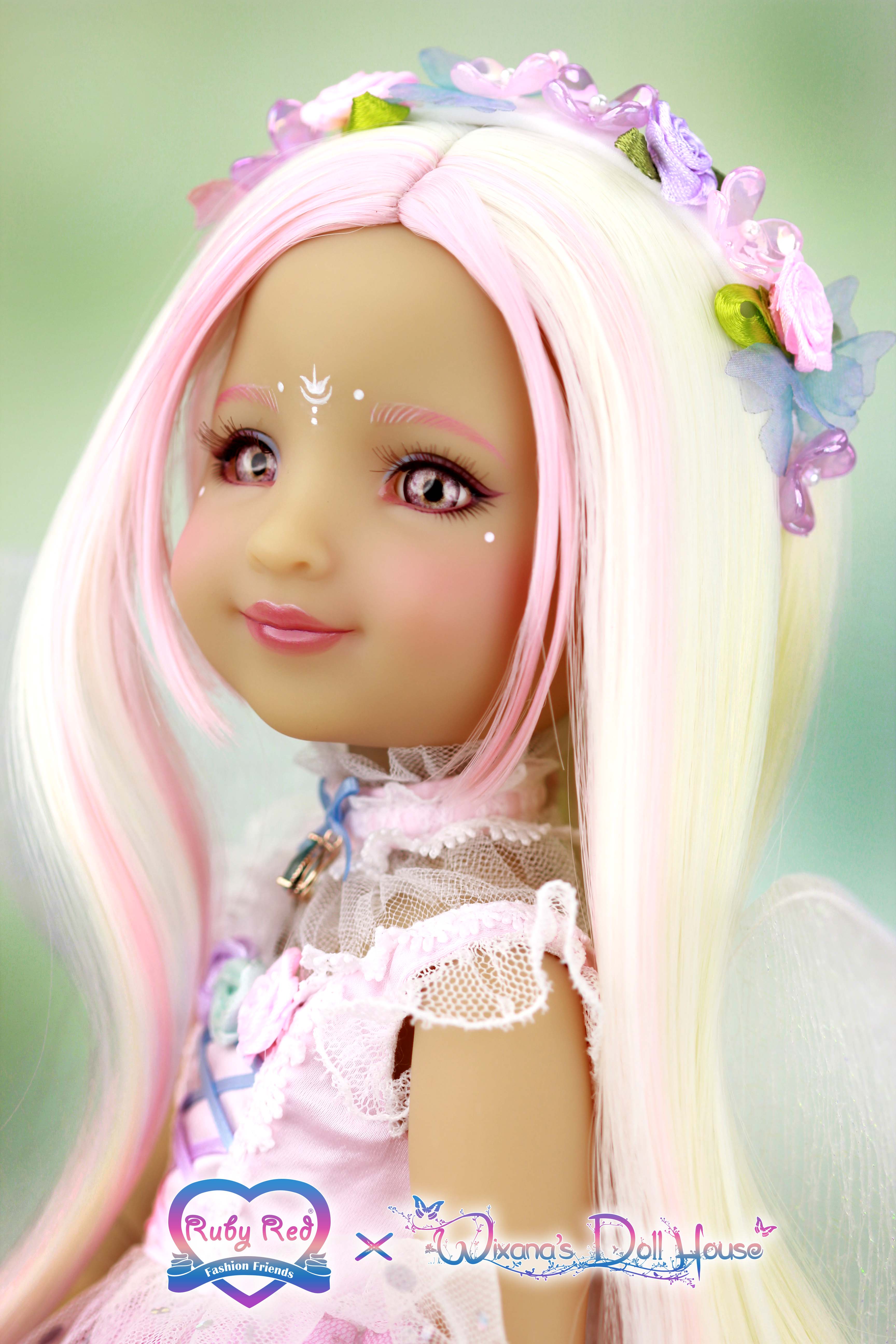 Doll with long blonde hair and pink accessories against a light green background