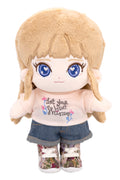 Fluffy Sara plush toy with blonde hair and blue eyes, wearing a white shirt with text and denim shorts.