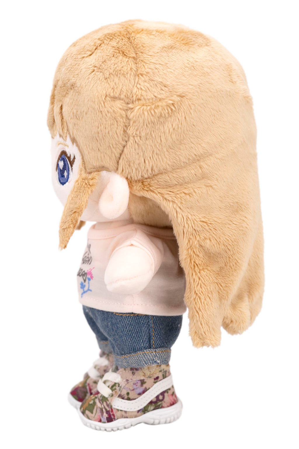 Plush Sara with a fluffy blonde hair on a white background