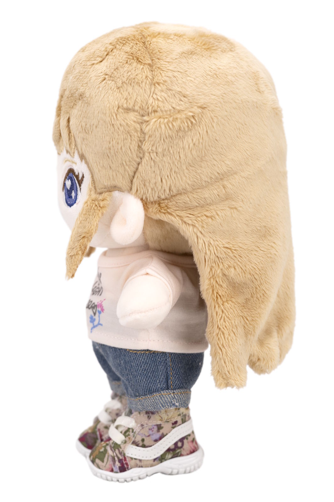 Plush Sara with a fluffy blonde hair on a white background