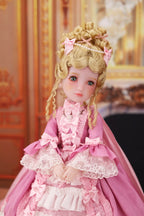 Doll in a pink dress with decorative elements against an ornate background