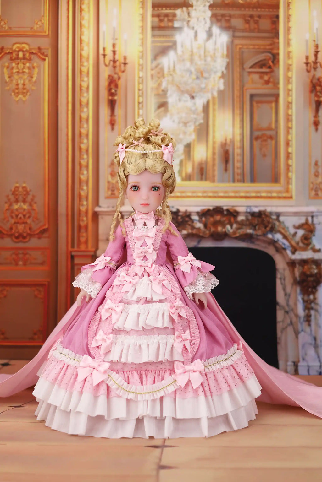 Doll in a pink and white gown with a decorative background