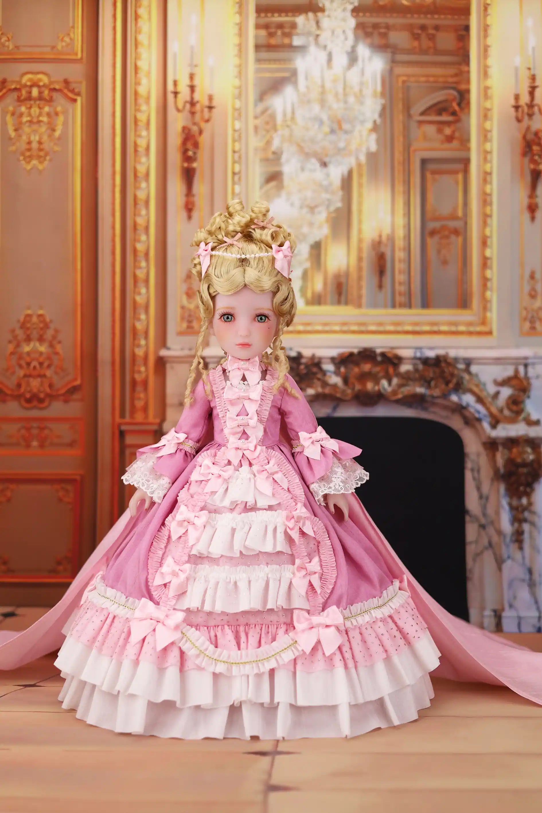 Doll in a pink and white gown with a decorative background