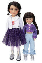 Two dolls wearing outfits with a white background