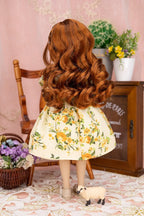 Doll with long wavy hair wearing a floral dress in a decorative room.