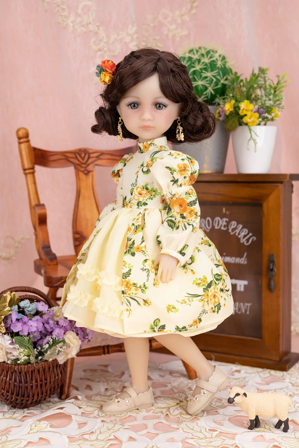Doll in a floral dress with a decorative background