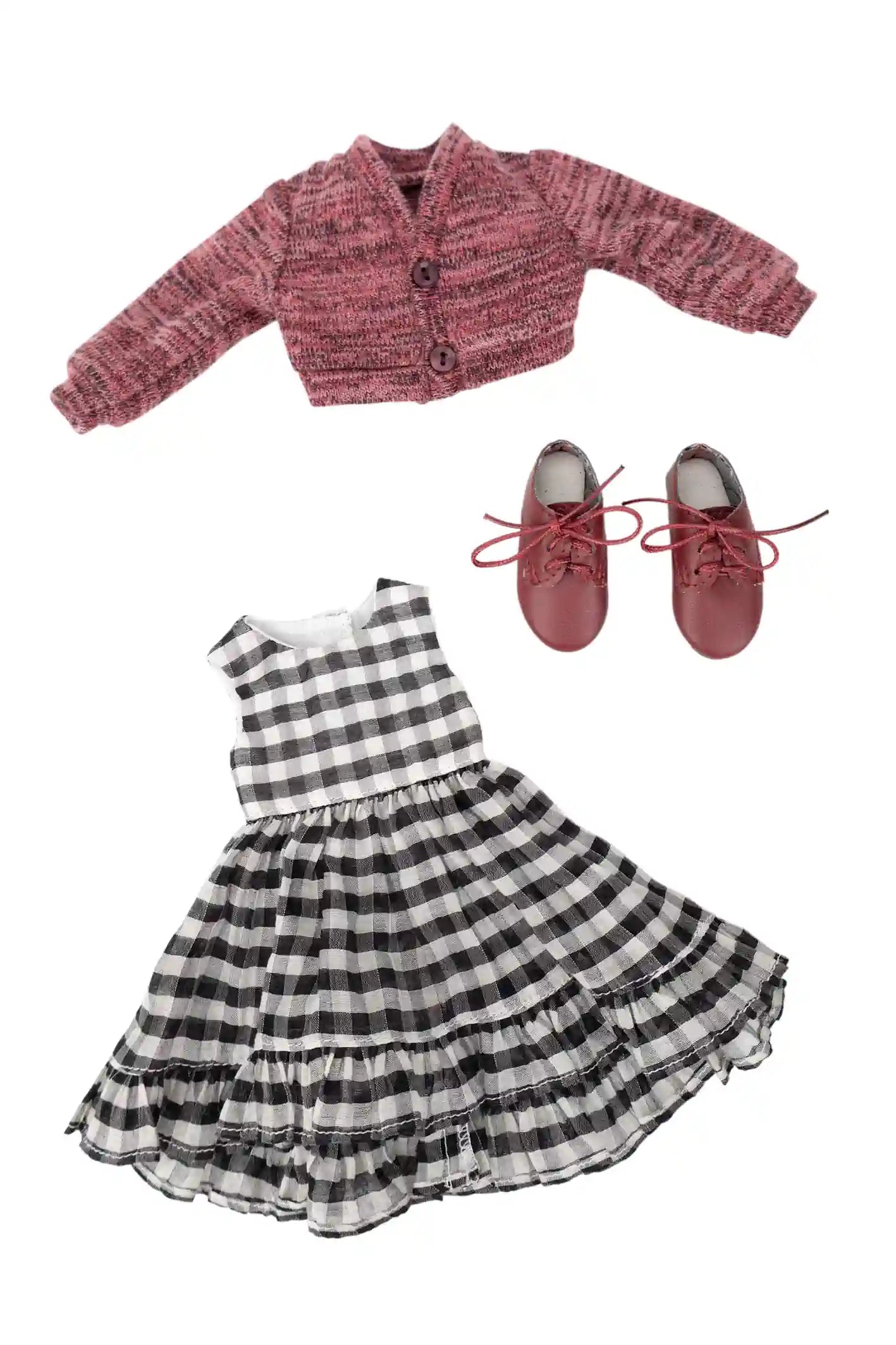 Pink textured jacket, black and white checkered dress, and red shoes on a white background