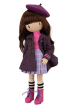 Gorjuss doll wearing a purple coat, beret, and pink shoes on a white background
