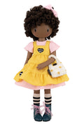 Gorjuss doll in dark skin with yellow dress on a white background