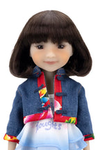 Doll wearing a colorful jacket on a white background
