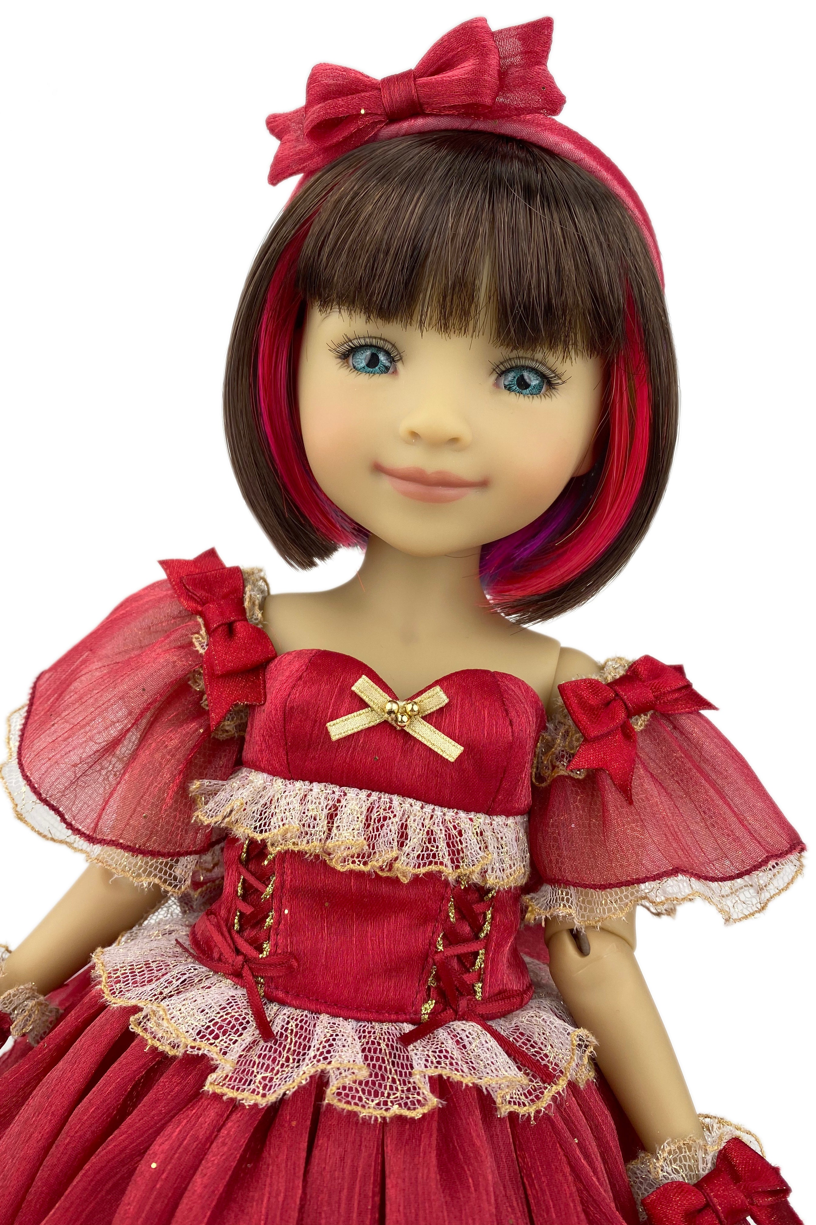 Doll with red dress and headband on a white background