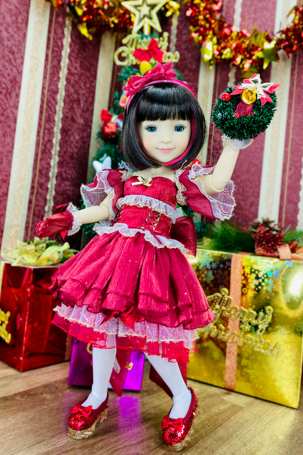 Doll in a red dress with festive decorations in the background