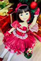 Christmas-themed doll in a red dress with decorative elements on a festive background