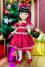 Doll in a red dress with Christmas decorations in the background