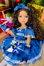 Doll in a blue dress with a bow headband, surrounded by festive decorations.