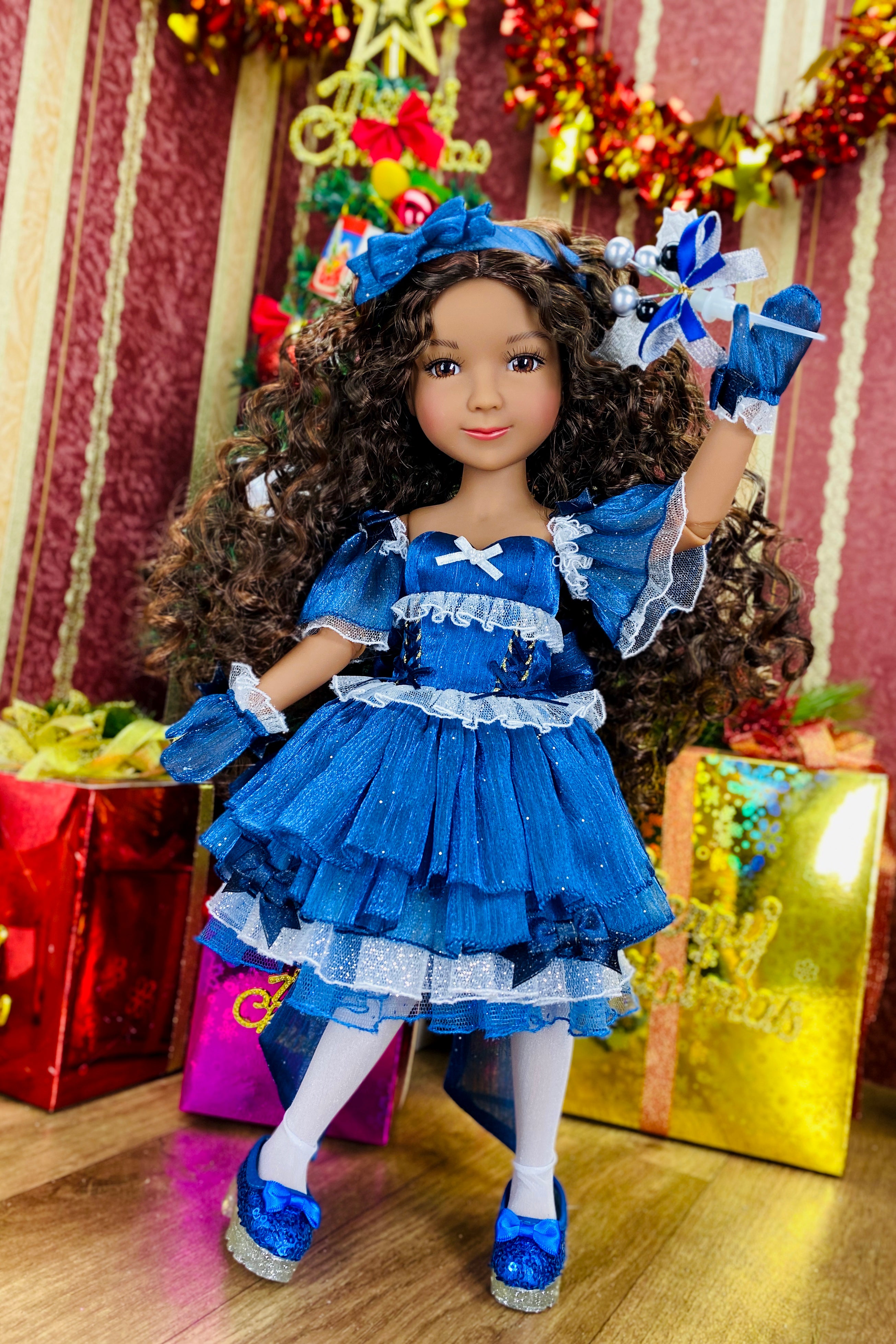 Doll in a blue dress with a festive background