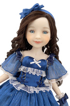 Doll in a blue dress with a matching headband on a white background