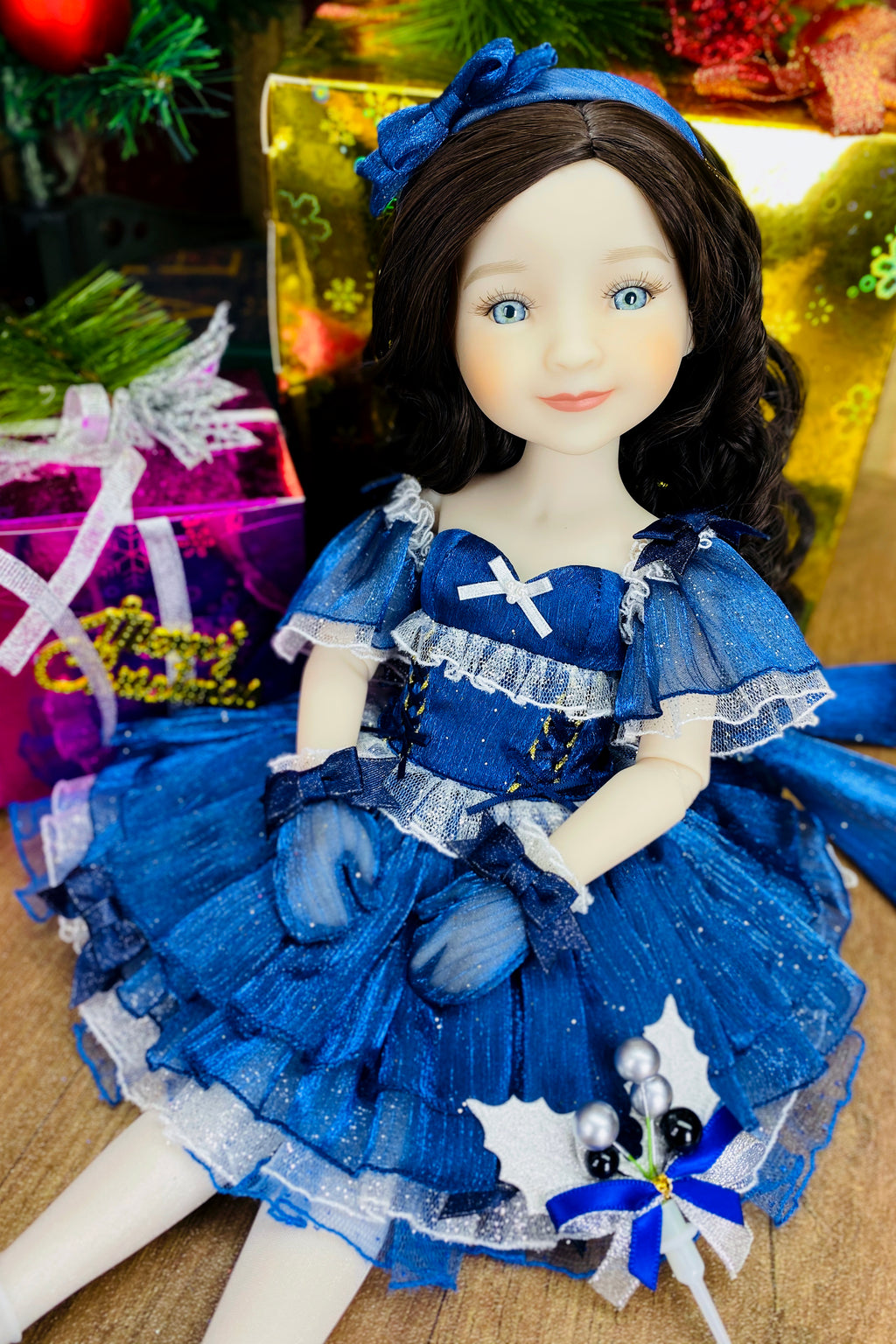 Doll in a blue dress with decorative elements on a textured surface
