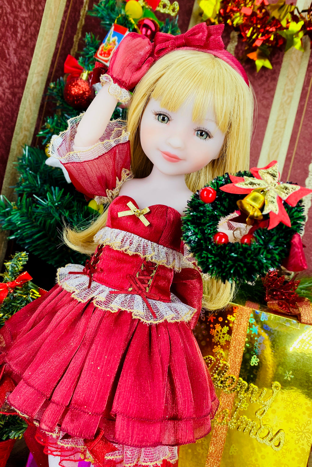 Doll in a red dress with a festive background