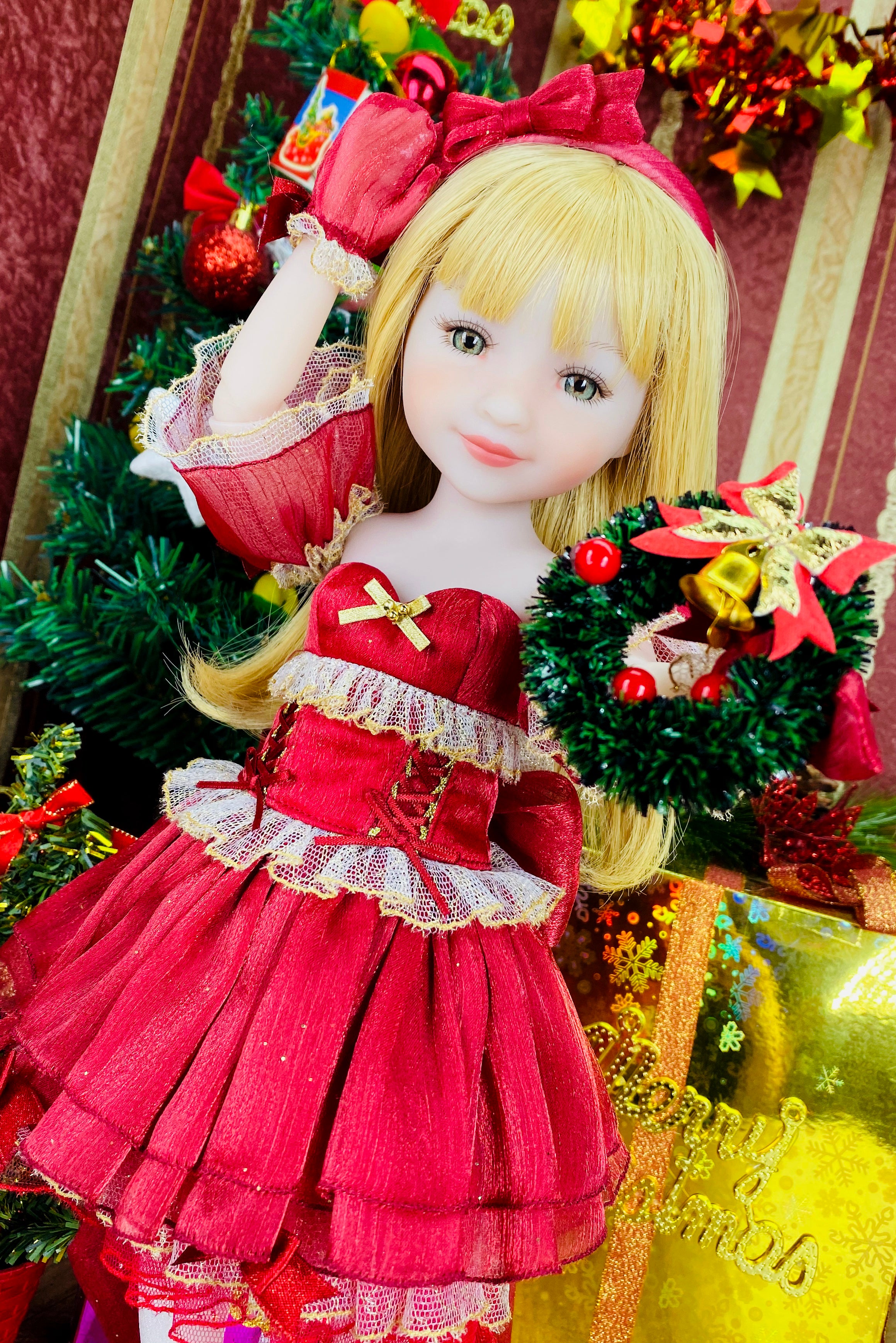 Doll in a red dress with a festive background