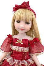 Doll in a red dress with a large bow on a white background