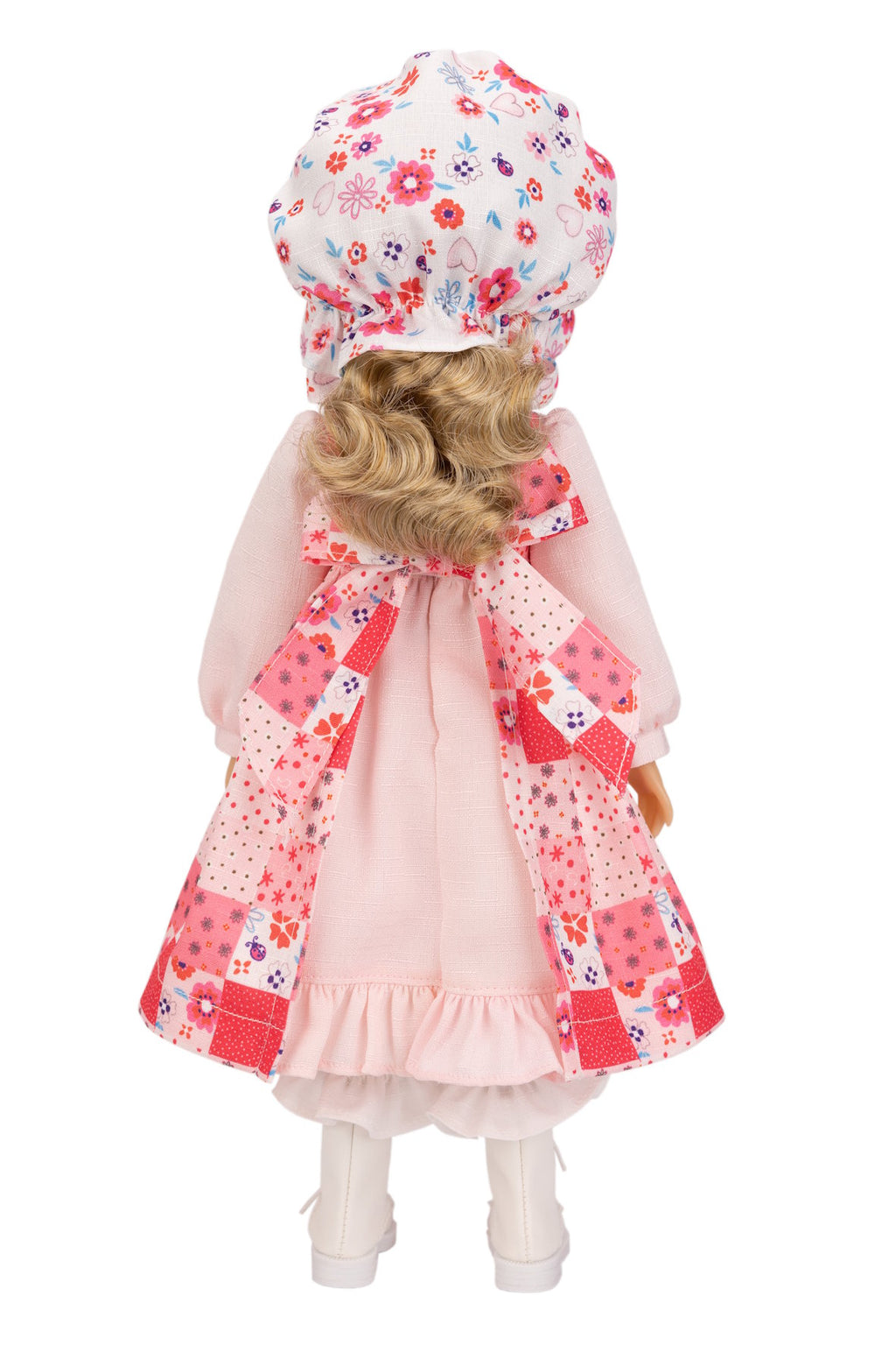 Holly Hobbie doll with floral hat and coat on a white background
