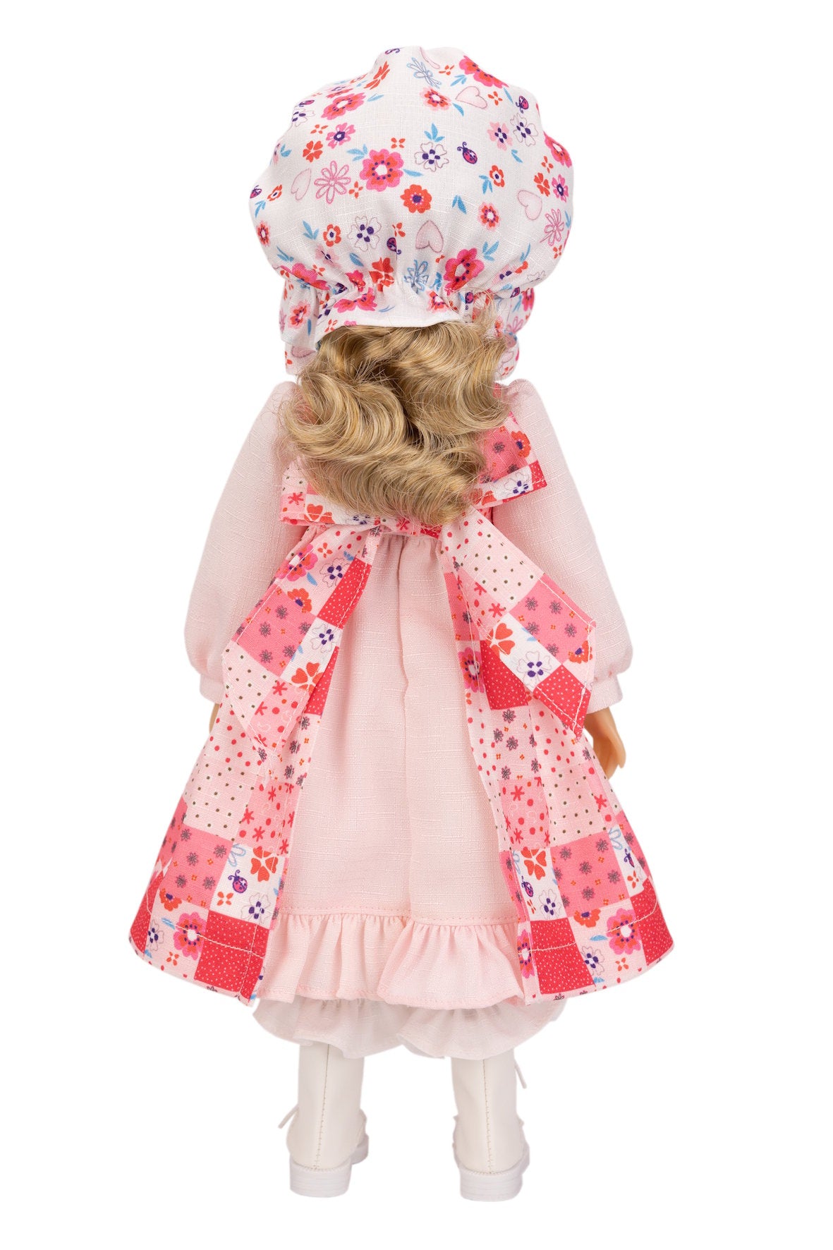 Holly Hobbie doll with floral hat and coat on a white background