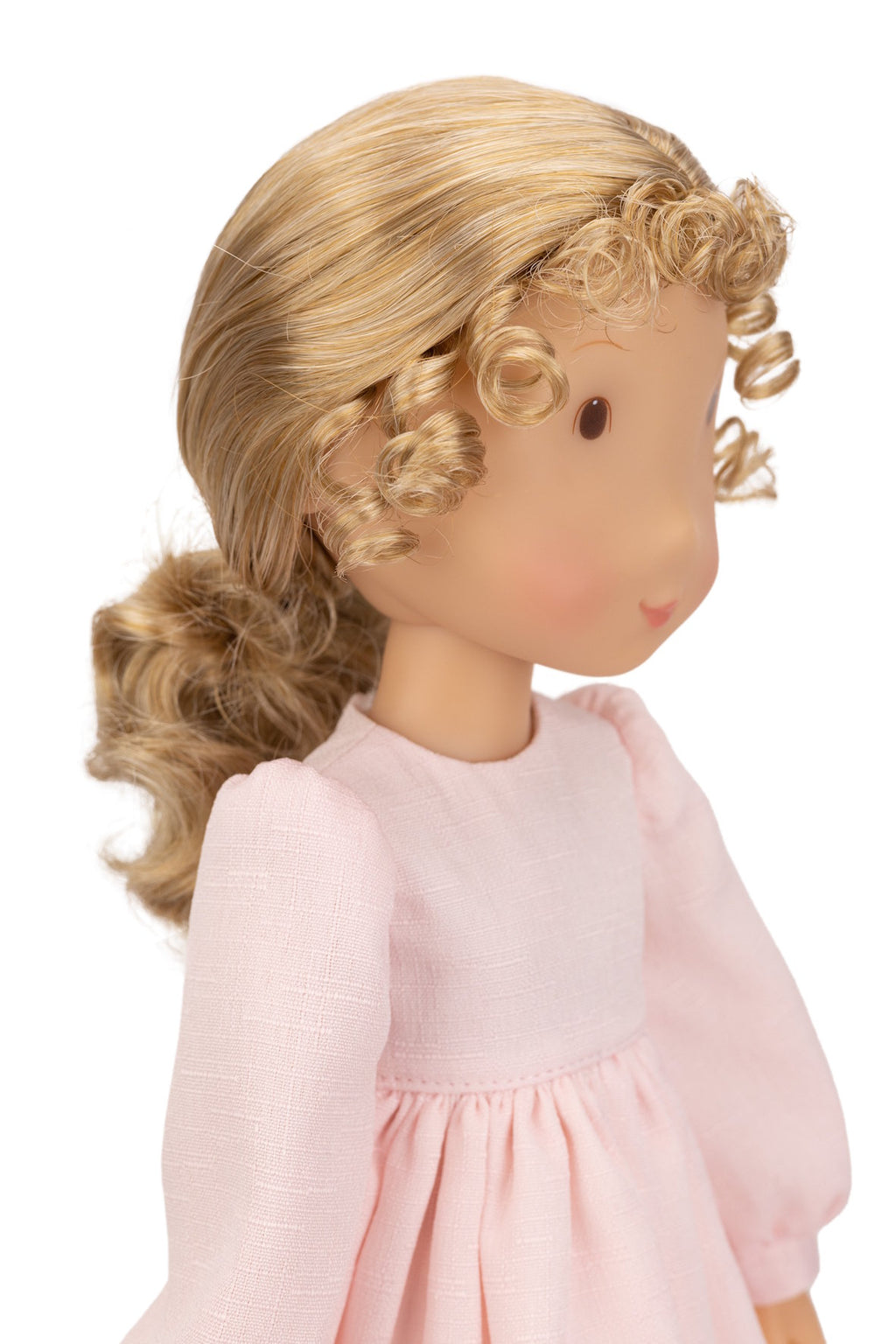 Holly Hobbie Doll with blonde hair styled in a ponytail wearing a pink dress on a white background