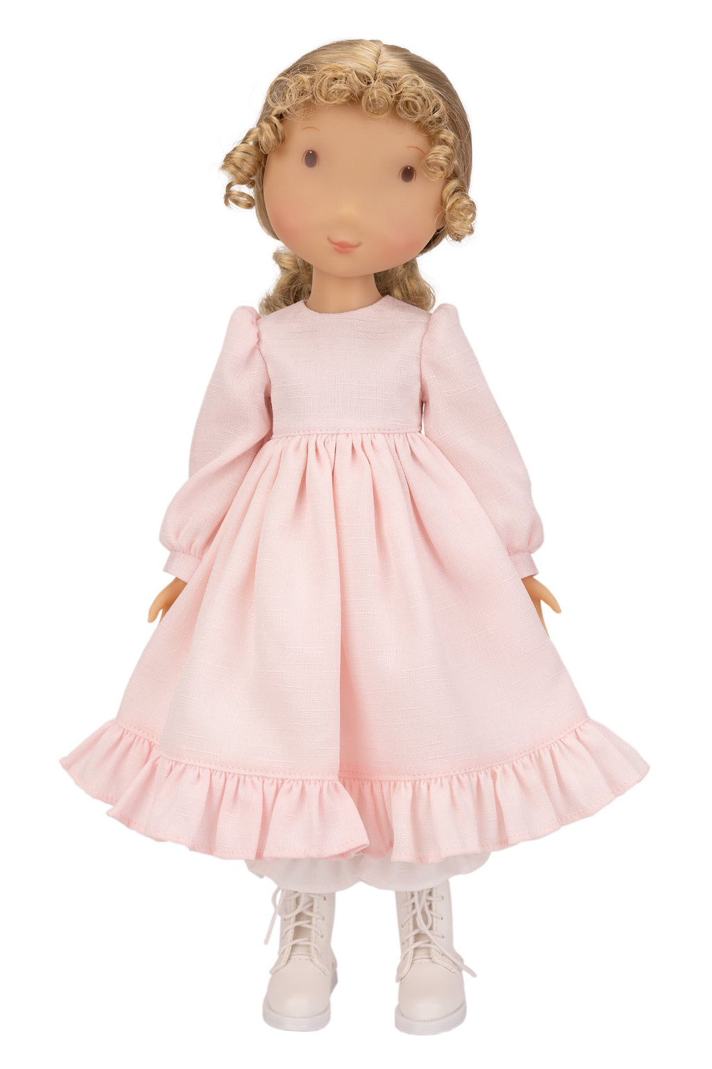 Holly Hobbie Doll wearing a pink dress with long sleeves on a white background