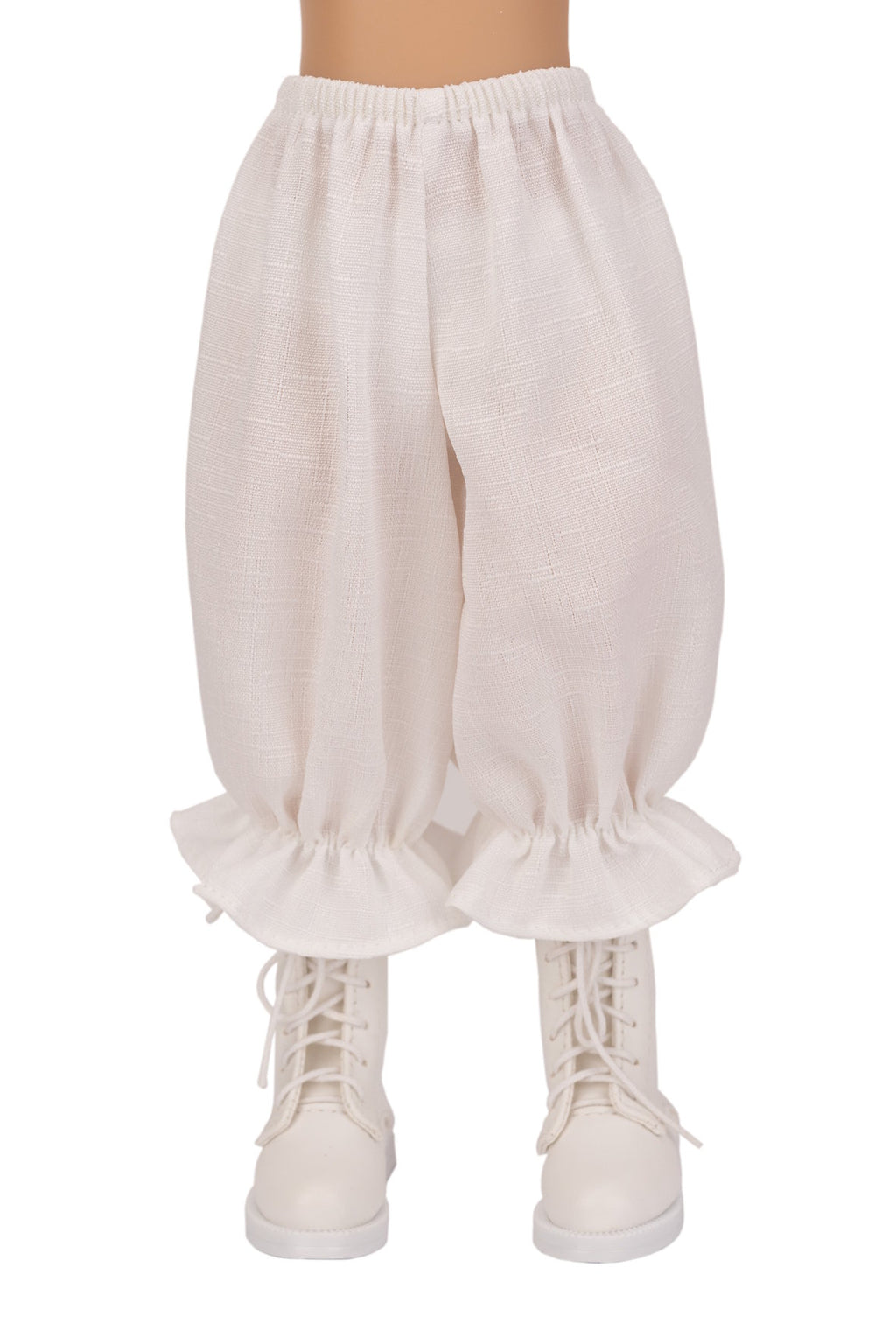 White ruffled pants worn with white sneakers on a white background