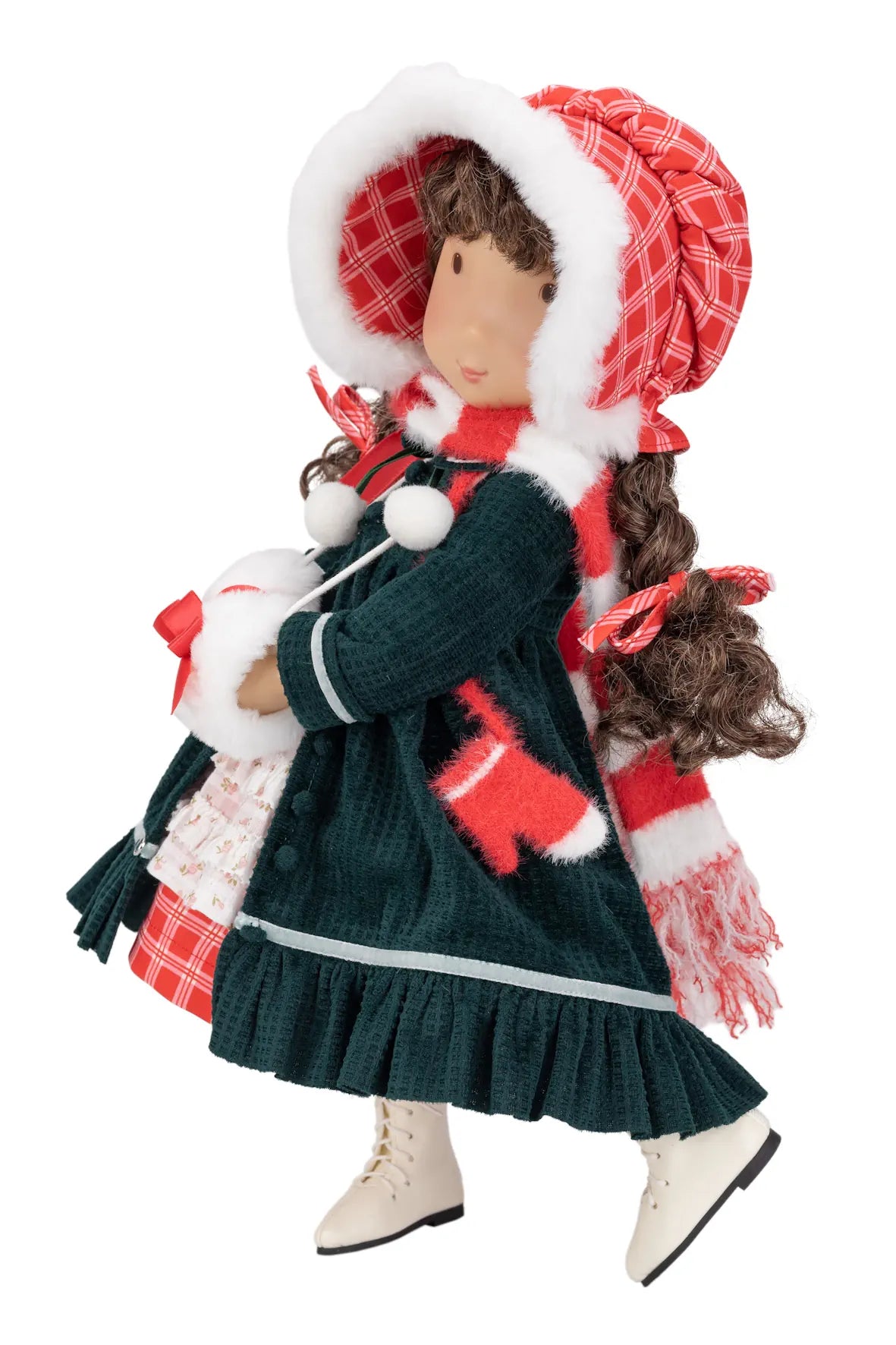 A Christmas-themed Holly Hobbie doll wearing a dark green dress, red and white plaid bonnet, matching scarf, and white boots, isolated on a white background.
