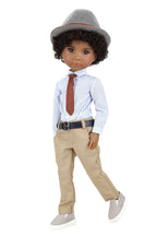 Doll wearing a formal outfit with a hat, shirt, tie, and pants on a white background