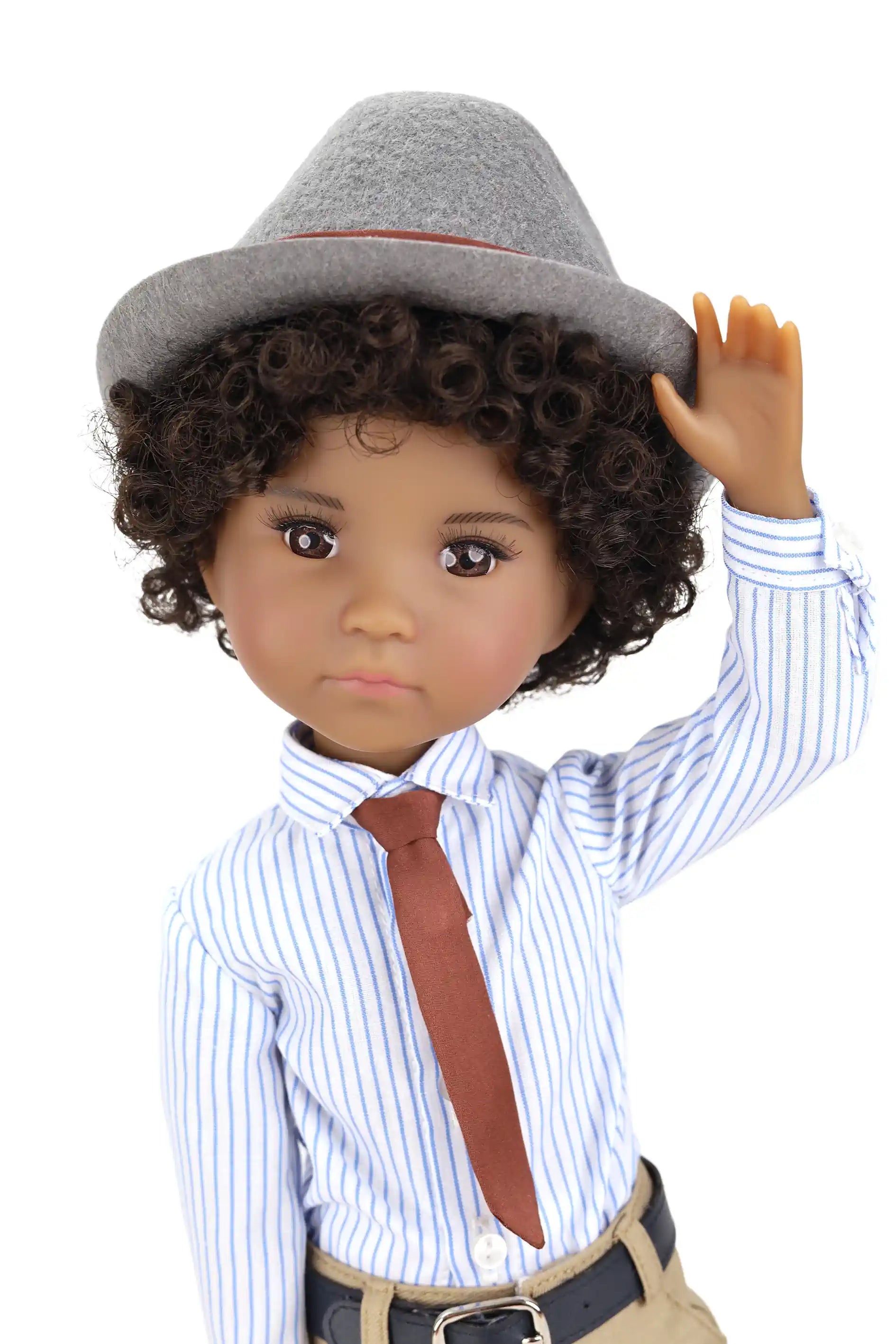 Doll with curly hair wearing a gray hat, striped shirt, tie, and beige pants on a white background