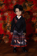 Doll wearing a traditional outfit with a floral background